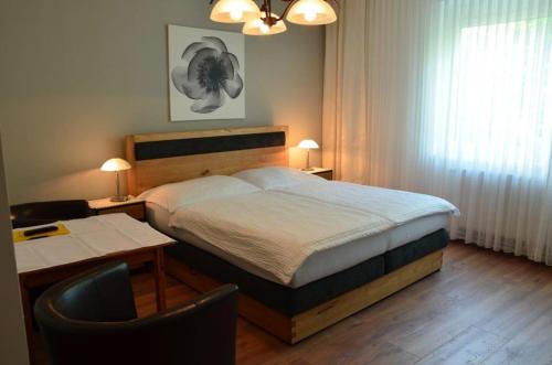 Un pat sau paturi într-o cameră la Gästezimmer Klinger-Tongisch