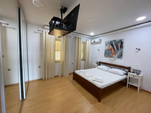Ένα ή περισσότερα κρεβάτια σε δωμάτιο στο AristotelousApartment