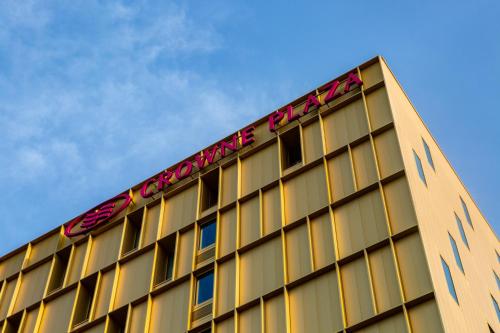 a building with a sign on the top of it at Crowne Plaza - Nice - Grand Arenas by IHG in Nice