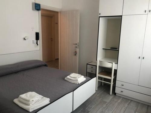 Postel nebo postele na pokoji v ubytování Hotel Oria