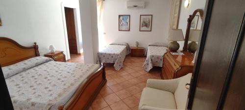 Un pat sau paturi într-o cameră la Bed & Breakfast Laino