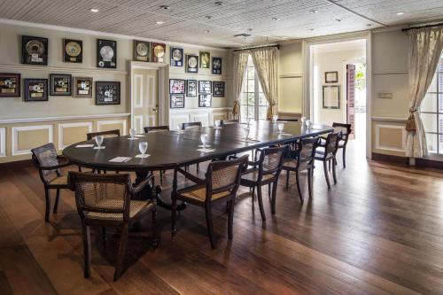 a large dining room with a table and chairs at Strawberry Hill in Newcastle