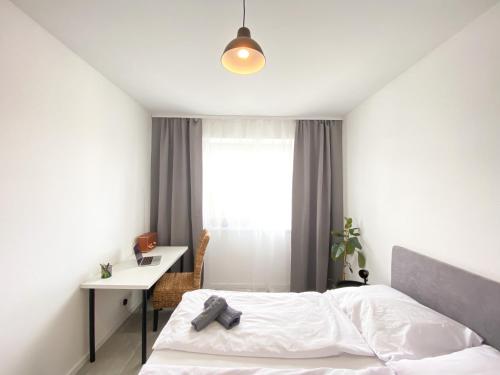 Un pat sau paturi într-o cameră la Concordia apartment