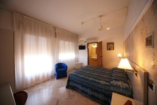 Postel nebo postele na pokoji v ubytování Hotel Liberty