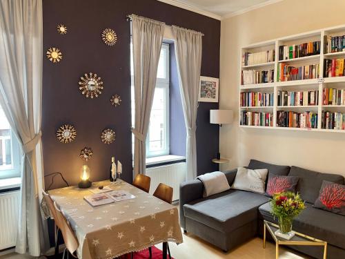 a living room with a couch and a table at Feel at home - Self Check In in Vienna