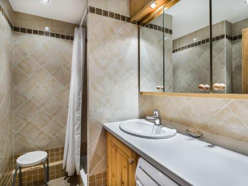 a bathroom with a sink and a mirror at Appartement Courchevel 1550, 3 pièces, 6 personnes - FR-1-562-4 in Courchevel
