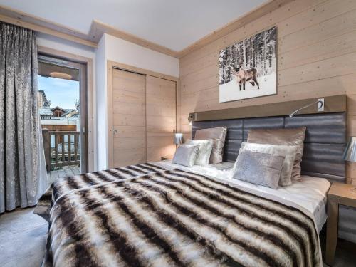 A bed or beds in a room at Appartement Courchevel 1550, 3 pièces, 6 personnes - FR-1-562-10
