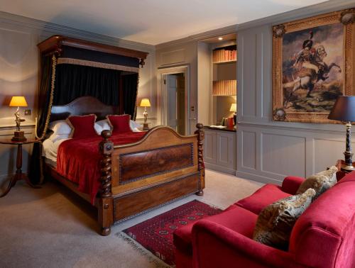 a bedroom with a large bed and a couch at Hazlitt's in London