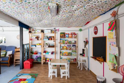a room with a table and a chalkboard on the ceiling at Casa Rural Solapeña in Pallide
