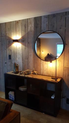 a bathroom with a sink and a mirror at O'Blanche, Viroinval Treignes in Treignes