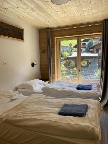 Postel nebo postele na pokoji v ubytování Arthur Chalet - Snow and Trek - Morzine centre