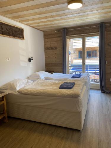 Postel nebo postele na pokoji v ubytování Arthur Chalet - Snow and Trek - Morzine centre