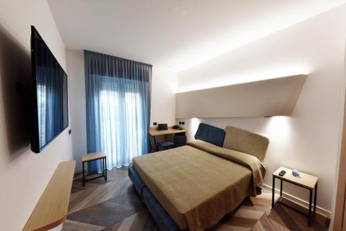 Ліжко або ліжка в номері Color Hotel Rimini