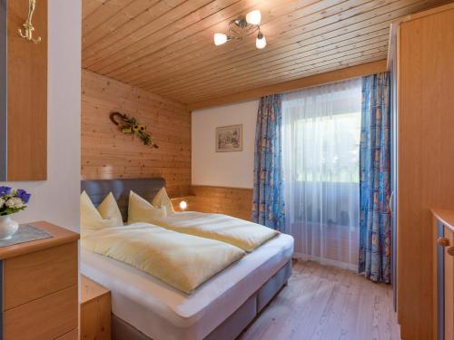 Un pat sau paturi într-o cameră la Ferienwohnungen Rieser