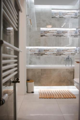 a bathroom with a shower and a sink and a tub at LUXURY OAK VILLAS in Bielsko-Biala