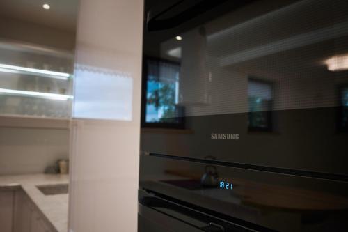 a kitchen with a stove top oven next to a counter at LUXURY OAK VILLAS in Bielsko-Biala