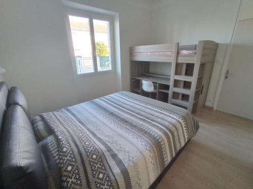 a bedroom with a bunk bed and a bunk ladder at LE VIEUX MOULIN in Aureilhan