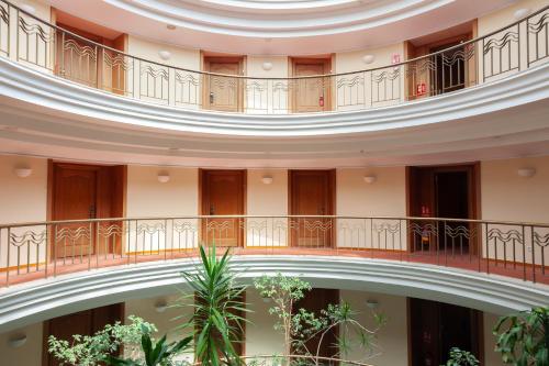 an image of a building with a spiral staircase at Hotel Hoyuela in Santander