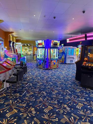 a gaming room with several arcade games in a casino at Lodge Sleeps 8- Parking Wifi Campsite Amenities in Jaywick Sands