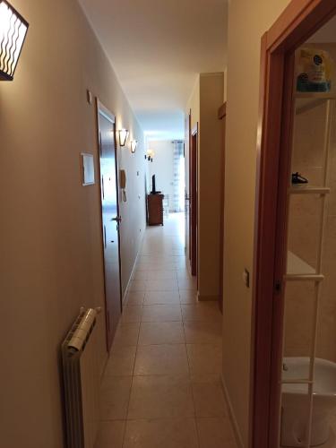 a hallway leading to a room with a hallwayngth at Altissim Tarter - Inclès - Ransol in El Tarter