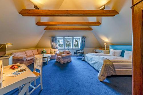 Llit o llits en una habitació de Friederikenhof Hotel Restaurant & Spa