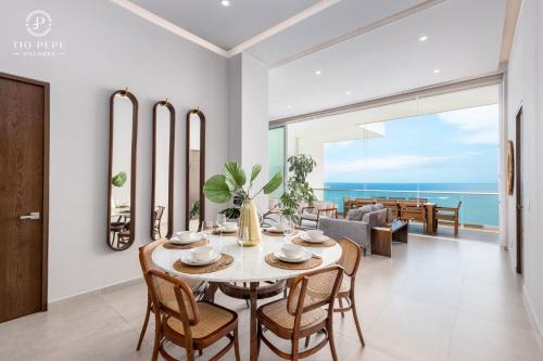 a dining room with a table and chairs at Harbor Puerto Vallarta 14003 in Puerto Vallarta