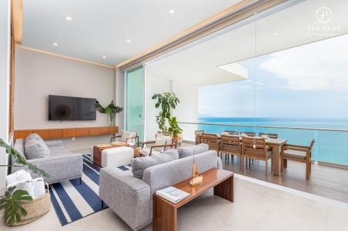 a living room with a view of the ocean at Harbor Puerto Vallarta 14003 in Puerto Vallarta