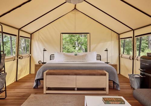 a bedroom with a bed in a tent at AutoCamp Catskills in Saugerties