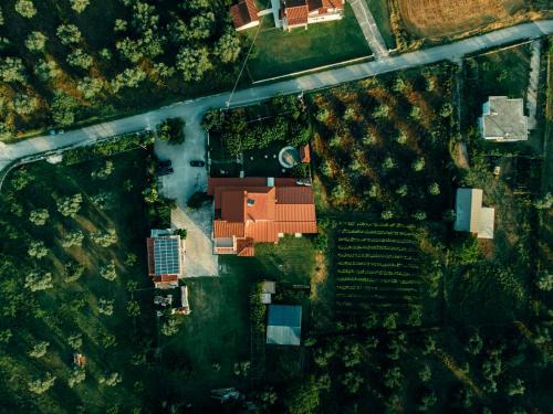 an overhead view of a building in a field at Erietta Rooms in Paramythia