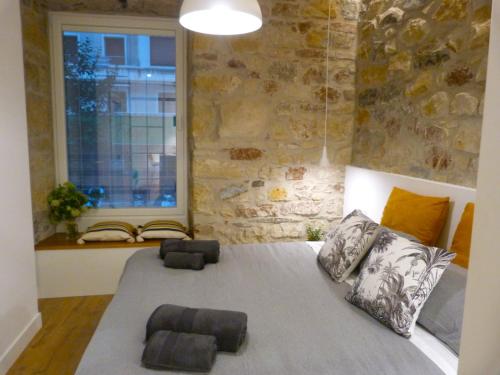Кровать или кровати в номере Chic Gran Vía, nuevo apartamento de diseño en Gros by ChicDonosti