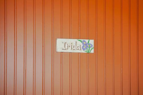 a sign that says india on an orange wall at Petros Giatras - Rooms in Zakynthos Town