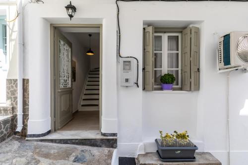 a hallway of a house with white walls at Skopelitian Relaxing House in Skopelos Town