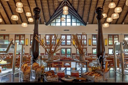 a restaurant with tables and chairs and a large window at Royalton Splash Punta Cana, An Autograph Collection All-Inclusive Resort & Casino in Punta Cana