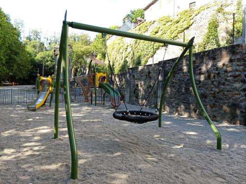 an empty playground with a swing at Hostellerie des voyageurs in Cassagnes-Bégonhès