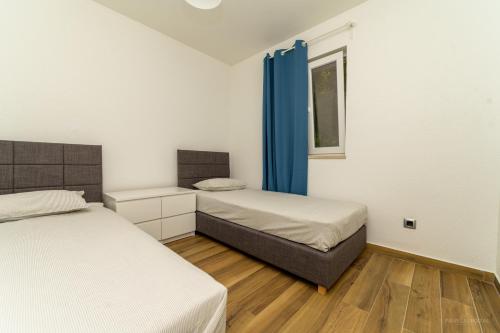 Кровать или кровати в номере STONE HOUSE MAGALI