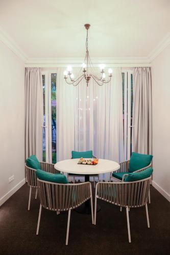 a dining room with a table and chairs at Garden Inn Resort Sevan in Sevan