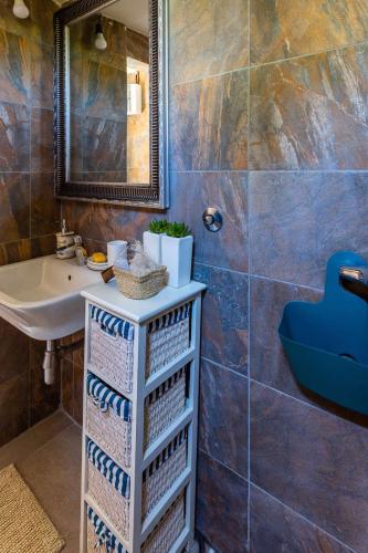 a bathroom with a sink and a mirror at Lake House Buric in Vranjina