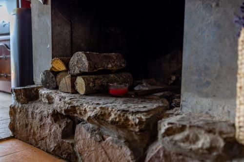 a pile of rocks sitting on a stone wall at Lake House Buric in Vranjina