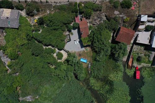 an overhead view of a house in a forest at Lake House Buric in Vranjina