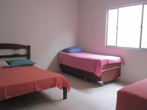 Łóżko lub łóżka w pokoju w obiekcie EcoRupestre Hostel & Receptivo