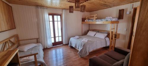 Ένα ή περισσότερα κρεβάτια σε δωμάτιο στο Pousada Alternativa KeKe