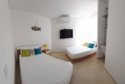 Llit o llits en una habitació de apartasuit exclusivo con vista al mar