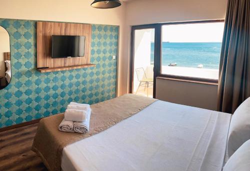 Кровать или кровати в номере The Kirte Hotel V Beach