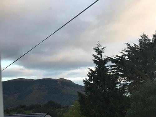 a view of the mountains from a house at Mourne country cottage in Warrenpoint