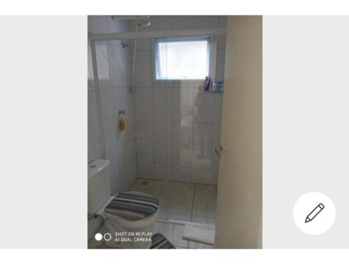 a bathroom with a shower and a toilet in it at Chácara Mig&Vá in Itupeva