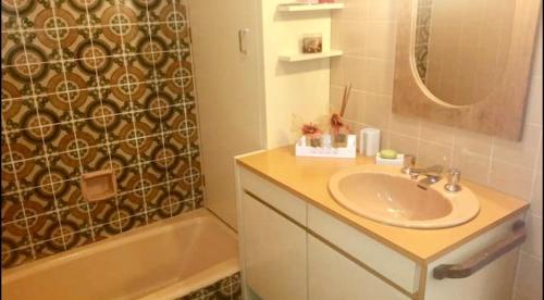 a bathroom with a sink and a shower and a tub at CASA GOLDONI GRAMADO 4 Quartos in Gramado