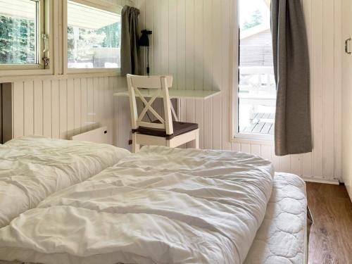 Postel nebo postele na pokoji v ubytování Holiday home Væggerløse CCXIII