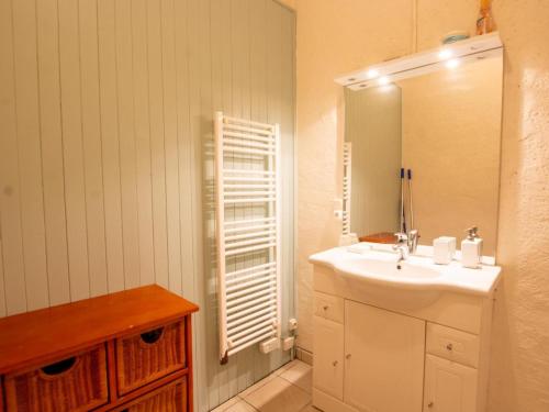a white bathroom with a sink and a mirror at Maison de village avec jardin, près de Villefranche du Périgord, idéale familles, animaux acceptés - FR-1-616-162 in Loubejac