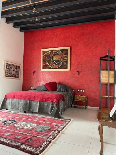 Postel nebo postele na pokoji v ubytování LARIMAR Gallery y Hotel Boutique