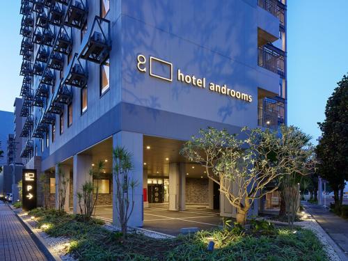 a building with a hotel andionics sign on it at hotel androoms Naha Port in Naha